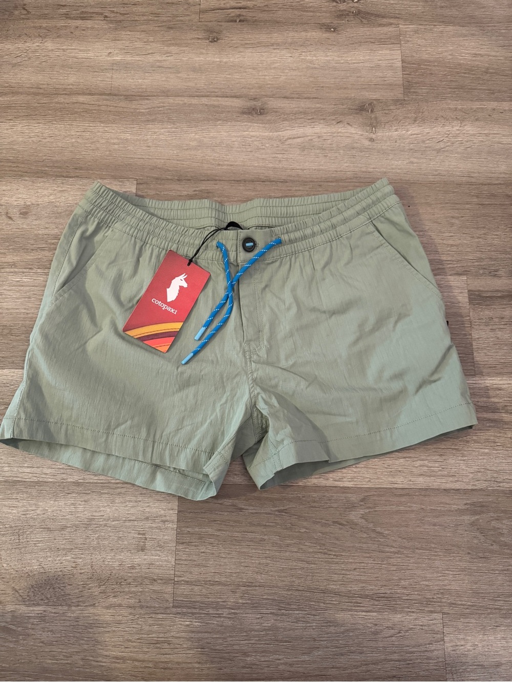 cotopaxi Women's Sage Green Athletic Shorts with Blue Drawcord